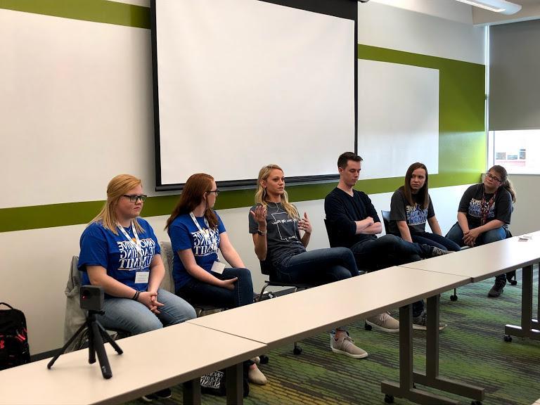 A panel of students sitting together